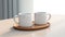 Mockup of two cups on a white table with accessories. in front