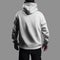 Mockup of a white oversized hoodie on a dark-haired man, back view