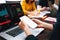 Mockup white screen smartphone in hands in front of group coworker business people