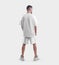 Mockup of white sportswear, t-shirt and oversized shorts on a man in sneakers, blank clothing for design, pattern, advertising,