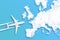 Model airplane design miniature blue background fluffy clouds in the shape of continent Europe. The idea of tickets for the trip,