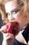 Model biting apple