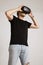 Model in blank black t-shirt putting on VR glasses