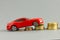 Model of  car on  background of coins,  concept of car loan, car insurance