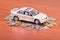 Model car on a placer of coins