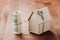 Model of cardboard house with key and dollar bills. House building, loan, real estate, cost of housing or buying a new home concep