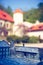 Model of the Castle in Pieskowa Skala with real buildings in the background, Braille system