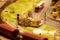 Model of the construction of an ancient dwelling in a rural area from wood and clay in landscape design. Architecture, life and