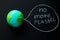 model of the Earth planet on a chalkboard with the inscription no more plastic,environmental concept