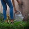 Model filling a watering can