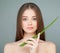 Model Girl Holding Green Aloe Leaf. Skin Care Concept