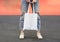 Model hold blank white fabric tote bag for save environment on street fashion