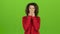 model mulatto woman sends air kisses, green screen background