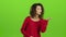 Model mulatto woman sends air kisses, green screen. Slow motion