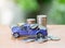 Model pickup truck load coin and coin stack on out of focus background