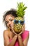 Model with pineapple in hands. African American Girl with Exotic Fruit. Cheerful woman with a smile relaxing on vacation. Image