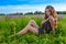 Model posing in a field of white lavendar flowers.