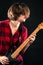 Model Red Flannel Shirt Playing Electric Guitar