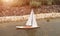Model sailboat on the garden lake