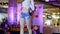 Model in shirt and denim shorts and sunglasses on catwalk, fashion Defile show of stylish clothes On podium,