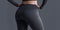 Model of slim fit girl in black yoga pants. fitness model.