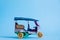 Model Toy tuk tuk isolated on blue background. Thai traditional taxi in Bangkok Thailand. Souvenir