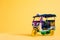 Model Toy tuk tuk isolated on yellow background. Thai traditional taxi in Bangkok Thailand. Souvenir