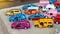 Model toys, large yellow and purple sedan cars