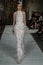 A model walks the runway wearing the Mira Zwilliner Bridal Collection Spring 2017