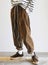 Model wearing Corduroy pants brown loose fit dark brown color paired indoor