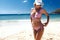 Model wearing fashion bikini posing on the beach