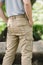 Model wearing yellow brown  color cargo pants or cargo trousers