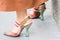 Model wears a pair of transparent pointed shoes by Fendi