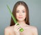 Model Woman with Cute Face, Fresh Skin and Green Aloe Leaf