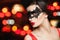 Model woman in fashion carnival mask on abstract nightly glitter bokeh background