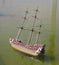 Model of the wooden antique sailing ship on wated