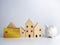 Model wooden house and piggy bank and credit card On a white background. Housing business concept