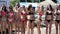 Models in bikinis standing outside