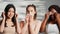 Models doing three wise monkeys sign with cotton pads on camera