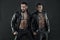 Models wearing leather jackets on bare torsos, fashion concept. Bikers with six pack and tattooed chests. African man