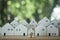 Models white big wooden houses with a miniature house in the center