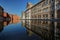 Modena, detail of Piazza Roma with military academy reflected on the water