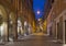 Modena - Via Roma street and the Military academy in the background at dusk