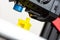 Modern 3D printer detail printing ABS yellow plastic ship.  on white background.