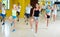 Modern active males and females dancing excited posing in studio