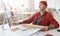 Modern Adult Man Working at Desk in Office