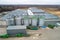 The modern agricultural sector. Top view, autumn. Metal hangars-vegetable stores