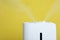 Modern air humidifier on yellow background