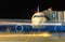 Modern aircraft front view in night , the concept of blur and blurred people around