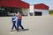 Modern Airport Mechanics Leaving Hangar